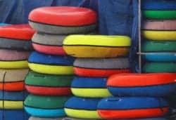 inner tubes stacked against a wall